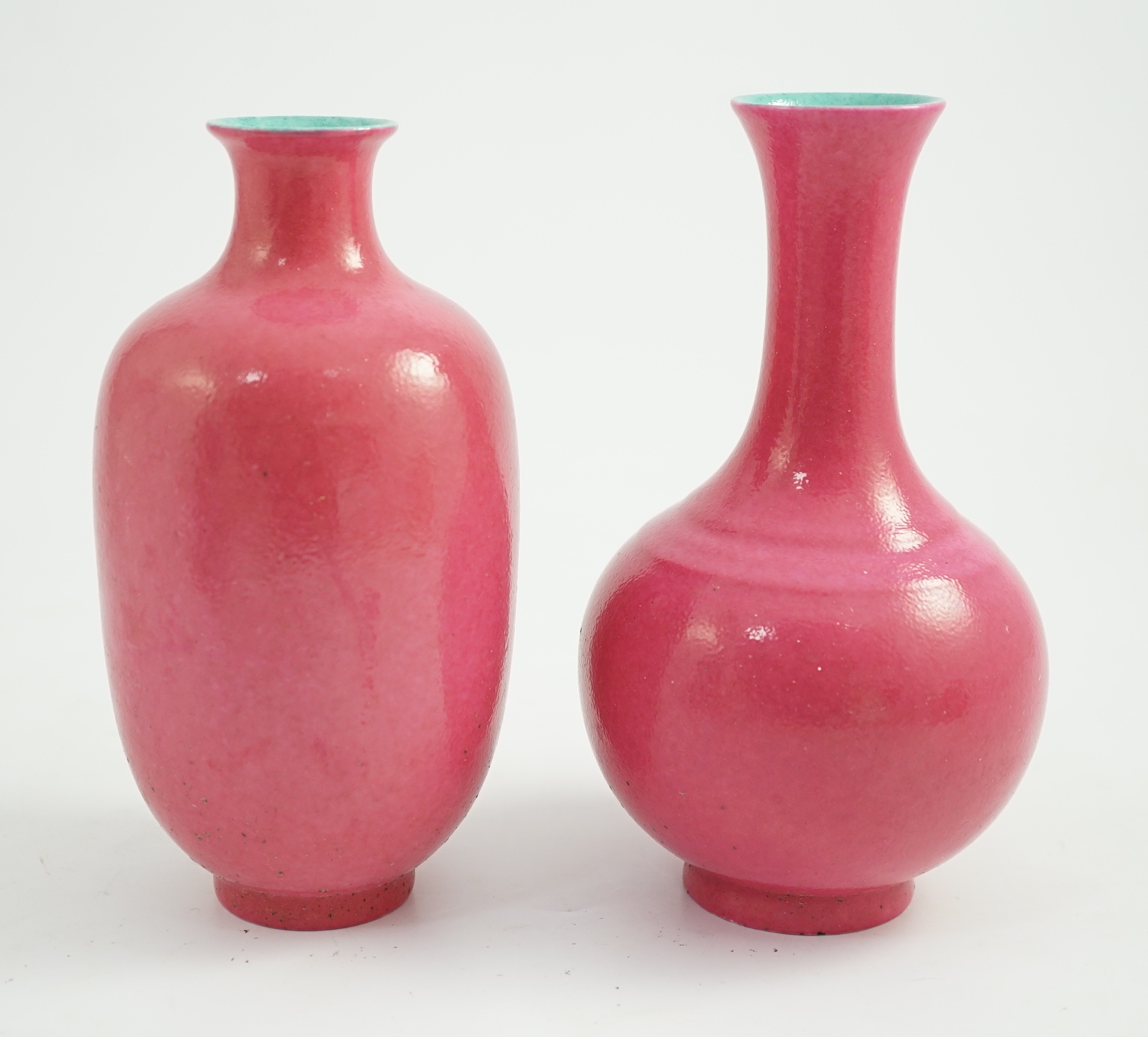 Two Chinese ruby ground vases, possibly Republic period, each with a printed four character Qianlong mark, 18.5 and 19.4cm high
